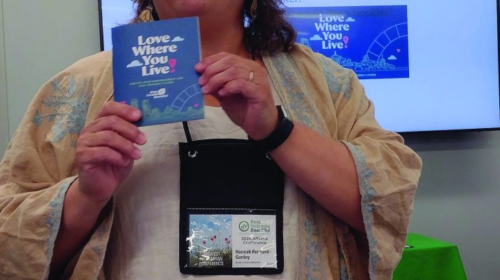 Hannah Rennard-Ganley, with Keep Omaha Beautiful, talks about a booklet on eco-friendly living during the Keep Nebraska Beautiful conference in Lincoln during the first week in June.